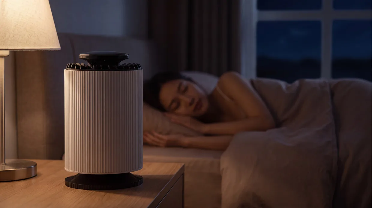 CloudPure running silently on the nightstand of a dim, calm bedroom at night